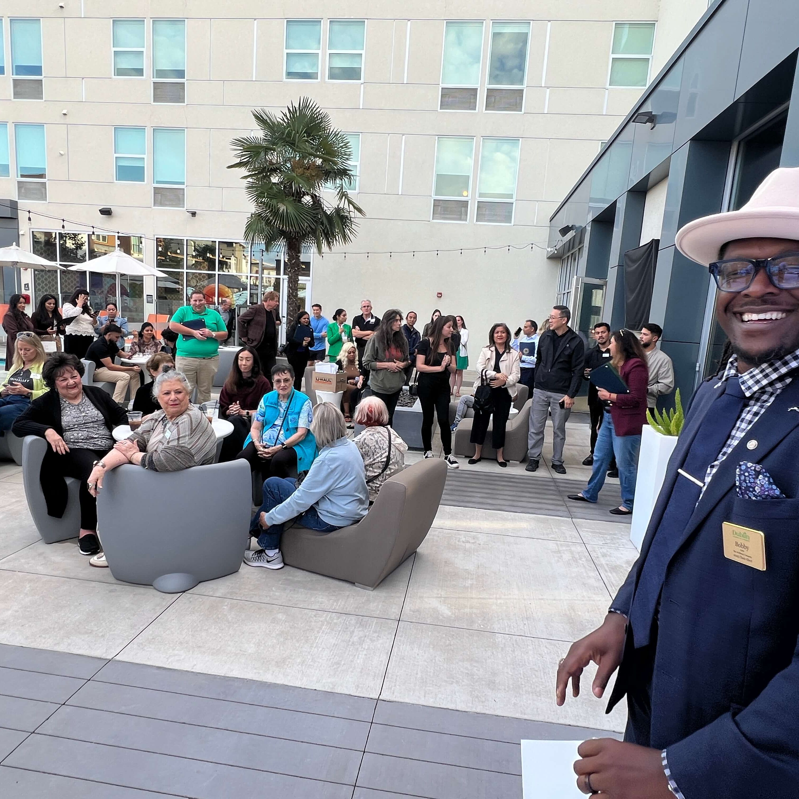 Speaker smiling in front of audience.